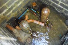 These hydraulic rams pump our spring water all over the farm. This design does not use any electric power, the water itself drives the pump.